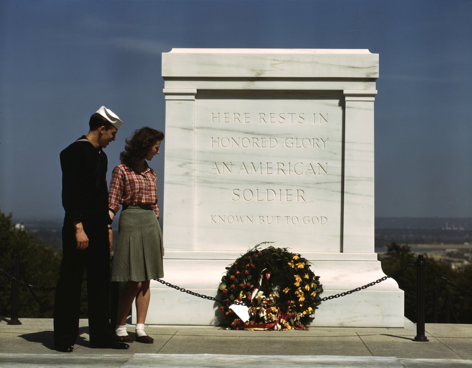 A US Navy sailor and a woman pause in front of the Tomb of the Unknown Soldier in  May of 1943.